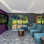 Adagio on the Green's Club Room includes cozy lounge areas for guests.